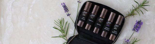 Saje Pocket Farmacy Physical Edition with a black case and lavender sprigs