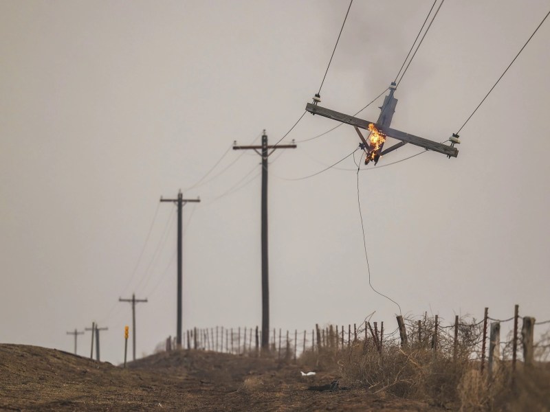 A telephone pole burns from the Smokehouse Creek Fire, Wednesday, Feb. 28, 2024, in Canadian, Texas. (AP Photo/David Erickson)