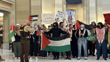 Protesters holding Palestinian flags and signs. Monday, Feb. 5, 2024.