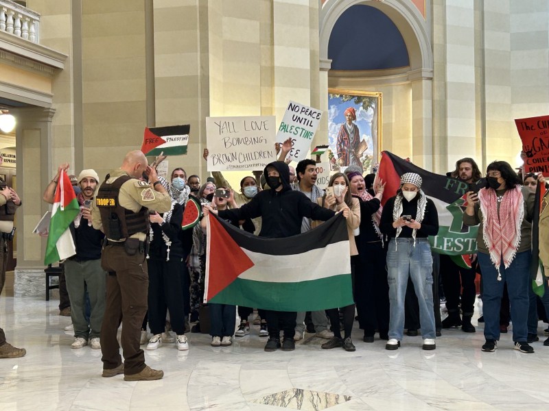 Protesters holding Palestinian flags and signs. Monday, Feb. 5, 2024.