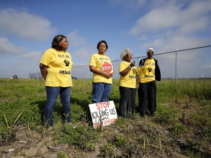 Myrtle Felton, from left, Sharon Lavigne, Gail LeBoeuf and Rita Cooper, members of RISE St. James, conduct a live stream video on property owned by Formosa on March 11, 2020, in St. James Parish, La. A Louisiana judge has thrown out air quality permits for a Taiwanese company's planned $9.4 billion plastics complex between New Orleans and Baton Rouge, Wednesday, Sept. 14, 2022, a rare win for environmentalists in a heavily industrialized stretch of the Mississippi River often referred to as "Cancer Alley."