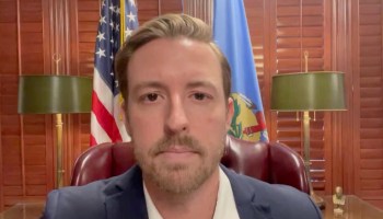 Ryan Walters in a video he posted to X on Feb. 26, 2024. He is sitting at his desk, behind him is both the American and Oklahoma flags. The video was posted two days before the list of groups calling for his removal from office was released.