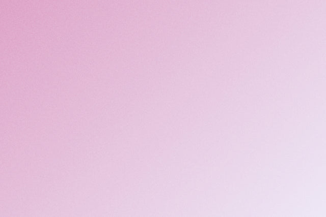 A young woman's hand passing a limited edition gift box and flowers to her mother's hand.