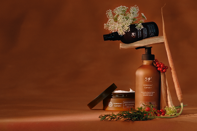 A person lathering in the shower with Saje body wash